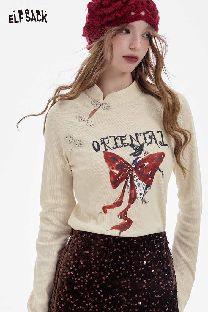 ELFSACK Soft Irregular Button Collar Bow Graphic Long Sleeve Tshirt